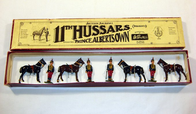 Britains: Set # 182 llth Hussars Dismounted: Prince Albert’s Own, Post War Set in “Whisstock” box (NM, box G) [8]. Tied on replacement card.