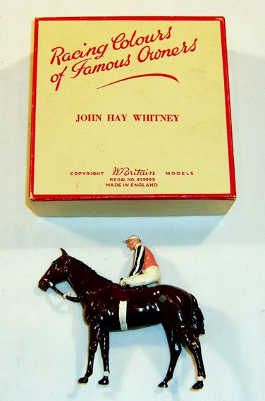 Britains: Racing Colours of Famous Owners: John Hay Whitney, pink with black and white silk sleeves Horse and Jockey in original box (M, few chips, Box G) (2) Leg broken off.