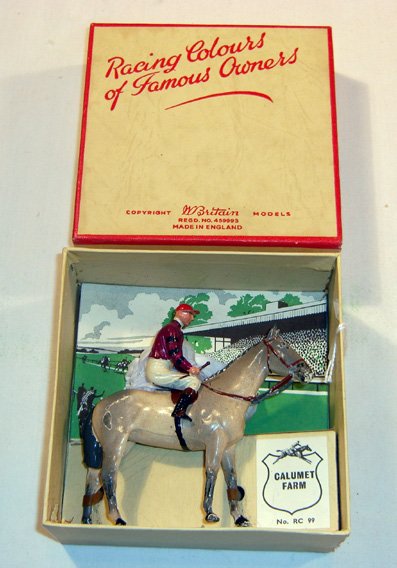 Britains: Racing Colours of Famous Owners: Lord Glanely No. 1463, black with red, white and blue in original box (VG, Box G) (2). Chip on horse.