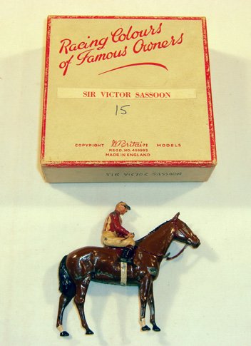 Britains: Racing Colours of Famous Owners: Alfred Van Derbelt scarlet with white diamonds in a Victor Sassoon box 15 (VG, chips, box G) (2). Whip broken, insert missing, horse damaged.