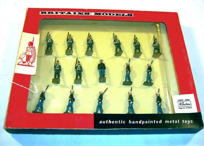 Britains: Set # 9381 U.S.A. Marines: And West Point Cadets. 8 West Point Cadets marching at the slope, and 7 Marines marching at the slope with officer tied in original, “See Through” box (M, box G) (16).