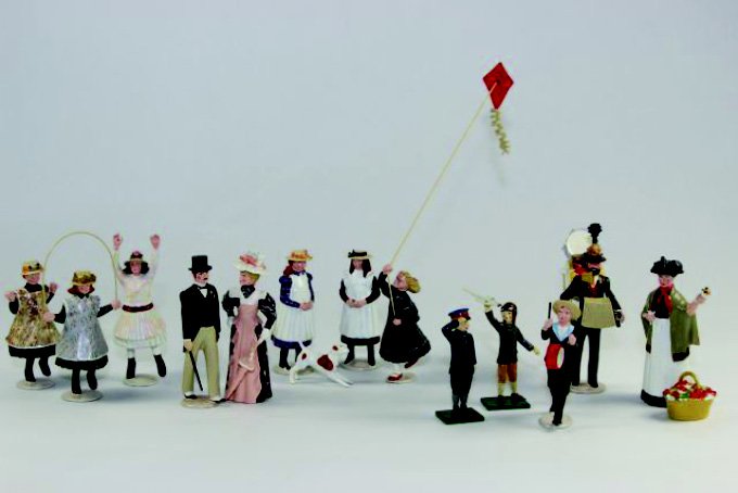 Imperial Town and Around: One Man Band, Girls Dog wKite Lady with Parasol, Boy with Drum, Boy with Plane, Boy Soldier, Girl Jumping Rope, Man In Top Coat, Lady Selling Flowers, with Boxes 16 Pieces.