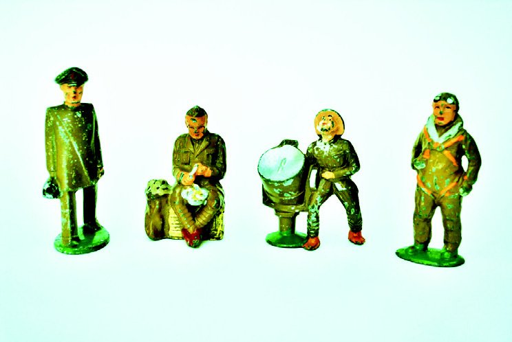 Barclay/Manoil Dimestore Assortment: Khaki Medical Officer, Seating Peeling Potatoes, Pilot, Man with Search Light. 4 Pieces, Unboxed. Condition Very Good.