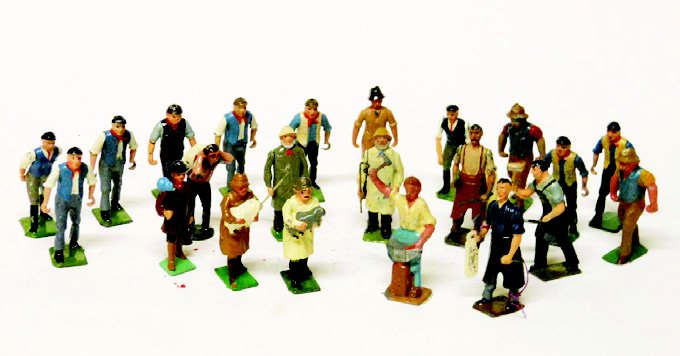 Britains and Johillco Farm People, etc.: Men to push barrows, Blacksmiths, Shepherds, and a Scarce French Hollowcast Blacksmith and Anvil. 22 Pieces. Unboxed. Condition Very Good.
