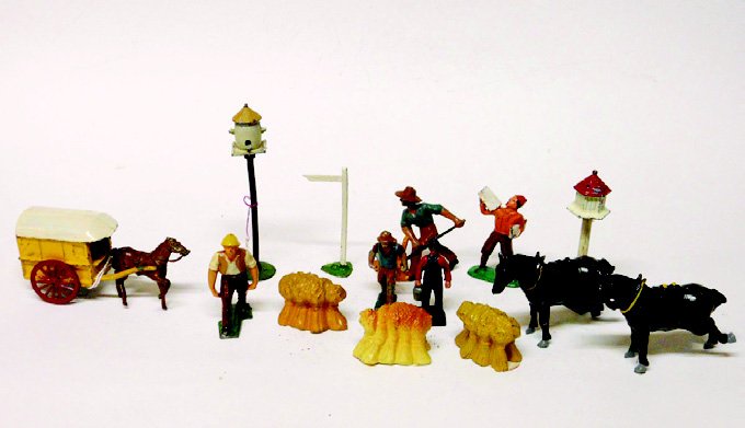 Charbens Cape Cart and French Farm: Charbens Cape Cart and Horse, 3 French Dimestores, a Barclay Dimestore Newspaper Boy, 2 Roydon Horses to be Shod, 2 Bird Houses, a Sign Post, and a Lincoln Log Farmer. 15 Pieces. Condition Very Good.