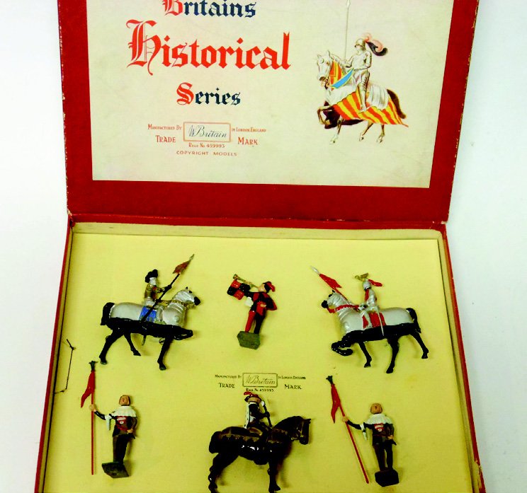 Britains Set #1258 Tournament Set: Post War. Tied in Original Box. Marshall, 2 Squires, Herald and Jousting Knights. 6 Pieces. Condition Excellent, Box Very Good.