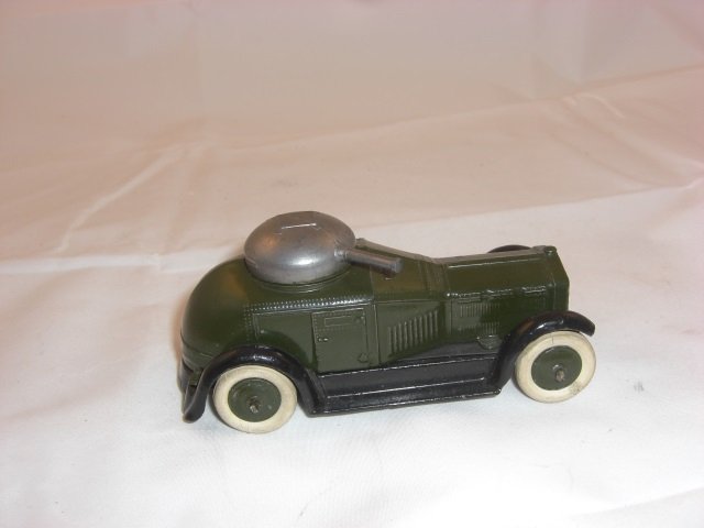 Britains Set #1321 Armored Car: Pre War. Dark Green with White Tires and Black Paper under Chassis. 4 1/2 Inches long. 1 Piece. Condition Near Mint.