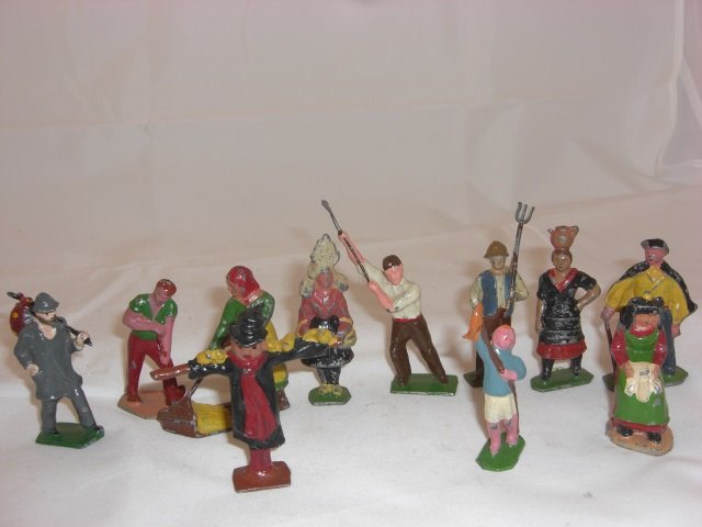 French Hollowcast: 65mm Figures. With Hobo #85, Man Digging #61, Woman Sweeping up Hay #53, Scarecrow #60, Girl in Costume #77, Man with Axe #80, Man with Pitchfork #86, Boy with Pole # 74, Woman with Jar on Head #75, M
