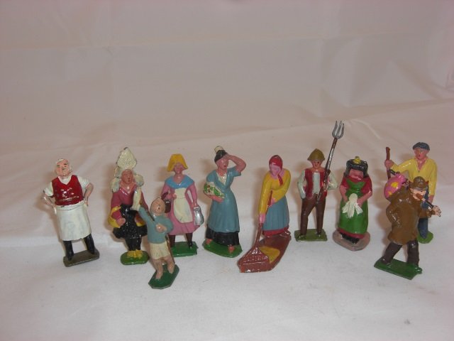 French Hollowcast: 65mm Figures. With Butcher/Baker, Girl in Costume #77, Boy with Pole #74, Girl Coming from Market #73, Woman Carrying Flowers, Woman Sweeping up Hay #53, Man with Pitchfork #86, Woman Sitting #87, Man