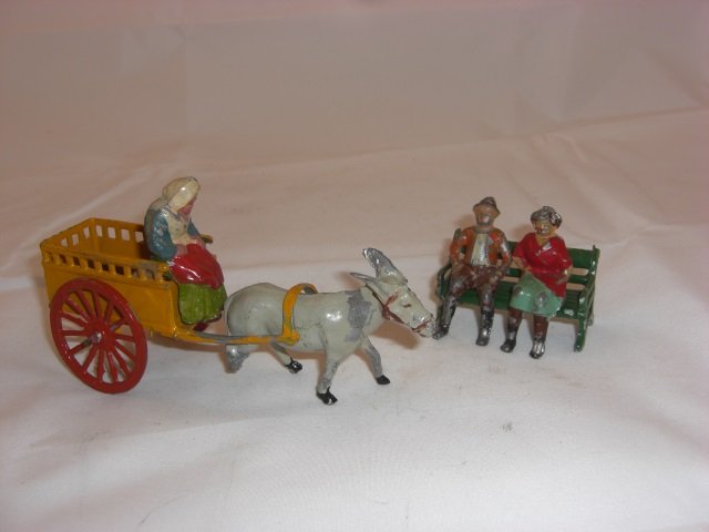 French Hollowcast: 54mm Figures. With Cart #49, Driver, Mule and Civilians Sitting on Bench. 5 Pieces. Condition Very Good; 1 leg broken on Mule.