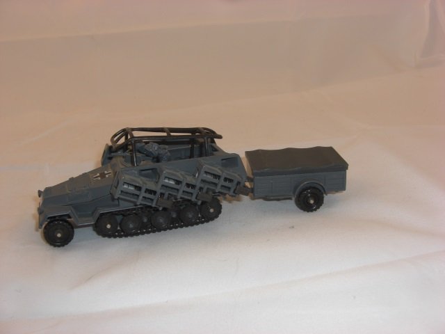 Corgi Rocket Launcher: 4 1/4 Inches long with 2 1/2 Inch Trailer with Rockets. 1 Piece. Condition Excellent.