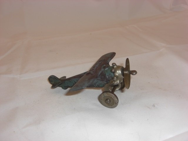Cast Iron Airplane: 4 1/2 Inches long. 1 Piece. Condition Good.