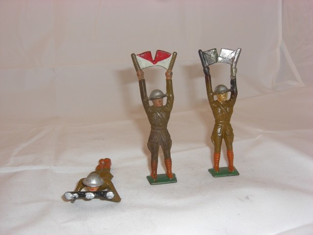 Grey Iron Soldiers: Includes 2 G18 US Doughboy Signaling and G20 US Doughboy with Range Finder. 3 Pieces. Condition Very Good; G18 US Doughboy with paint off one set of flags.