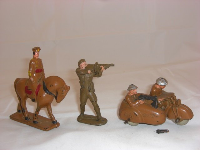 Auburn Rubber Military Pieces: Includes A12 Mounted Officer, A33 Tank Defender and A24 Motorcycle with Sidecar. 3 Pieces. Condition Very Good; Tip of gun broken.
