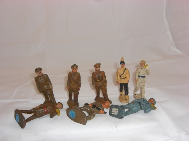 Auburn Rubber Military Figures: Includes A3 Infantry Bugler, A5 Foreign Legion Officer and 3A8/9 Infantry Officer. 8 Pieces. Condition Good; 3 will not stand.