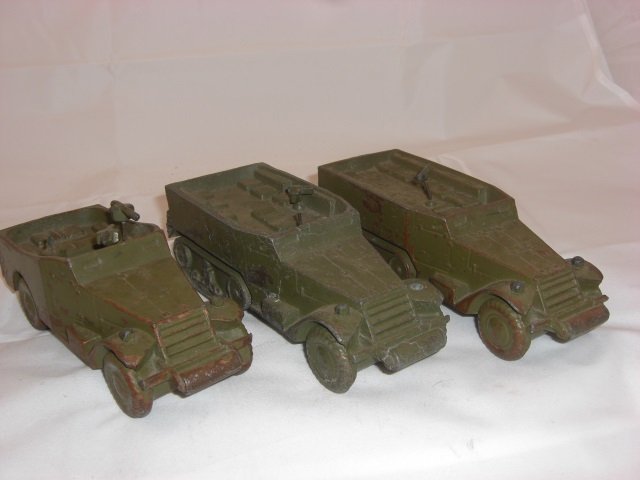 Metal Armored Cars: Includes two 6 1/2 Inches long and Painted Brassie. One 6 Inches long and Pot Metal; All with Fixed Wheels. 3 Pieces. Condition Excellent.