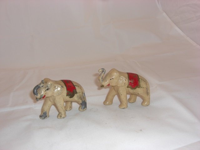 Metal Elephants: 2 3/4 Inches High at Trunk and 3 1/2 Inches long. Made of Solid Lead. 2 Pieces. Condition Excellent.
