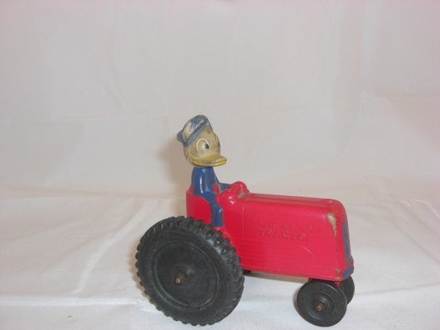 Rubber Mickey's Tractor: 4 1/2 Inches long and 4 1/2 Inches High. 1 Piece. Condition Excellent.