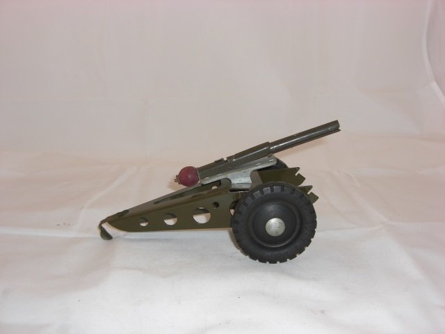Buddy L Cannon: 8 Inches long and 4 Inches High with Hard Rubber Wheels and Working Spring. 1 Piece. Condition Very Good; Barrel in 2 Pieces and 1 Slides out freely.