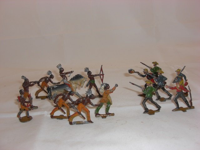 Cowboys and Indians: Unknown Manufacturer. Flats Measuring 1 3/4 Inches Tall. 14 Pieces. Condition Excellent; 3 Weapons broken.