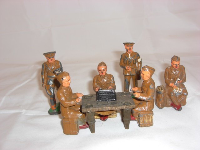 Barclay Soldiers: Includes B151 Typist, Typewriter and Table, 2 B151A Typists, B111 Peeling Potatoes, B81A Army Doctor, B116 Officer Reading Orders and B151 Typist. 6 Pieces. Condition Very Good; B116 Officer with smal