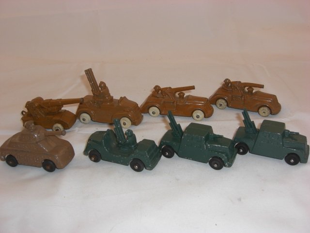 Barclay Vehicles: 2 BV6 Green Armored Army Truck Measuring 2 7/8 Inches long, 2 BV4 Green and Brown Army Trucks with Guns Measuring 2 3/4 long, 2 BV15 Cannon Cars Measuring 3 5/16 Inches long, BV69 Tank Measuring 2 5/8