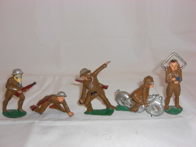 Manoil Soldiers: M93 with Gas Mask and Gun, M56 Bomb Thrower, 2 Grenades in Pouch, M33 Motorcycle Rider, M116 Radio Operator Standing and M71 Crawling Scout with Gun. 5 Pieces. Condition Excellent.