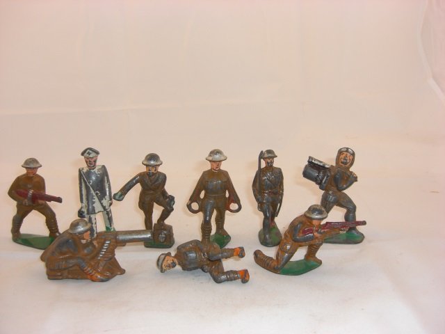 Manoil Soldiers: M41 Sitting Machine Gunner, M34 Doctor in White, M49 Tommy Gunner, M86 Paymaster, M57 Stretcher Carrier with no Medical Kit, M9 Officer with Hollow Base and M15 Aviator Carrying Bomb and Sniper Kneeli