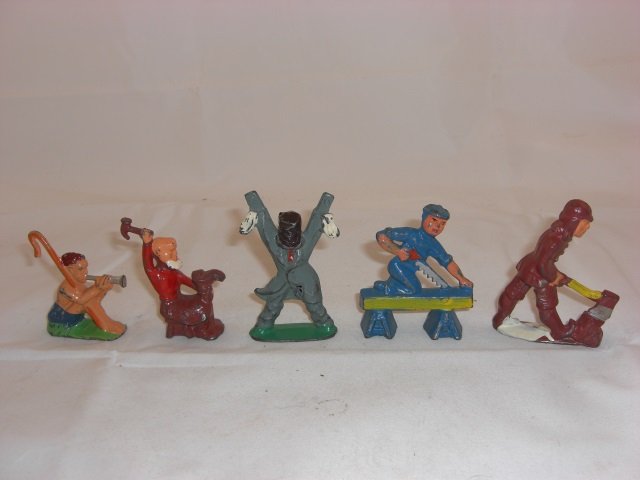 Manoil Civilians: M155 Shepherd with Flute, M149O Old Man Fixing Shoe, M140 Scarecrow with Top Hat and M153 Carpenter Sawing Lumber. 5 Pieces. Condition Excellent; M140 Scarecrow with hole in upper leg.