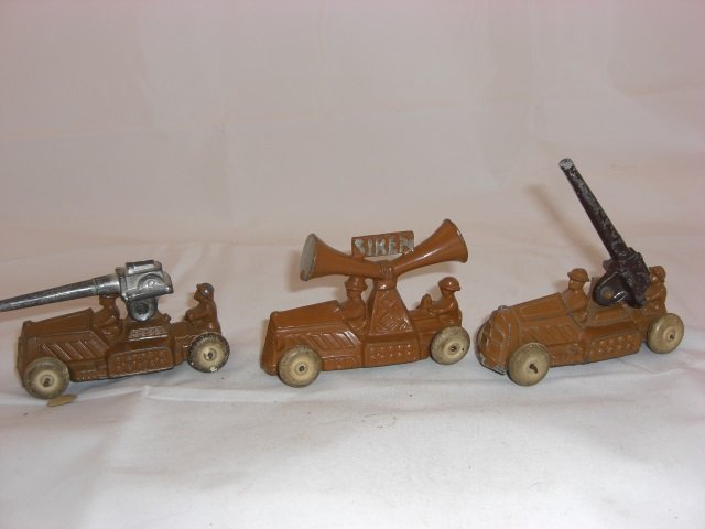 Manoil Vehicles: 2 Cannon 75 Armored Cars with Anti-Aircraft. Cannon 75A Armored Car with Siren Cast with Vehicle. Each Measuring 3 1/2 Inches long. 3 Pieces. Condition Excellent; Cannon loose on second car and does n