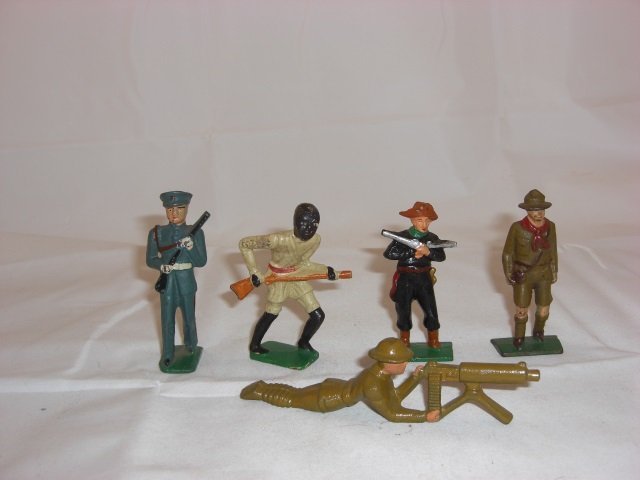 Grey Iron Figures: G40 US Marine, G86 Ethiopian Tribesman, G75 Pirate Chief, G73 Boy Scout Walking and G62 US Machine Gunner. 5 Pieces. Condition Excellent.