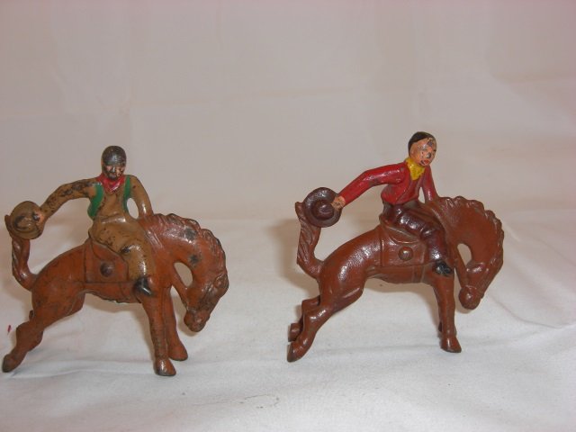 Grey Iron Mounted Cowboys: 2 G58 Cowboys Firing Pistols Rearward. 2 Pieces. Condition Very Good.