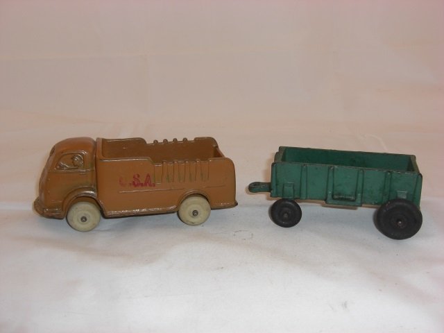Auburn Truck and Wagon: Truck Measures 5 1/2 Inches long and 2 1/4 Inches High. Wagon Measures 3 3/4 Inches long and 1 3/4 Inches High. 2 Pieces. Condition Excellent.