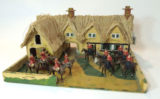 Heyde Hunt Figure's 60mm with Huntsman Cottage: Uniquely Made for FAO Schwartz, The Huntsman Cottage measures 18 Inches by 15 1/2 Inches by 9 Inches in Heigth. 10 60mm Heyde Hunt Figures. 6 Women Side Saddle and 4 Men. Circa 1940. 11 Pieces. Condit