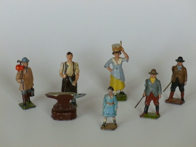 Britains Farm People: Shepard Boy, Girl, 2 Boys with Sticks, Blacksmith and Anvil, and Milkmaid. 7 pieces, unboxed, condition very good