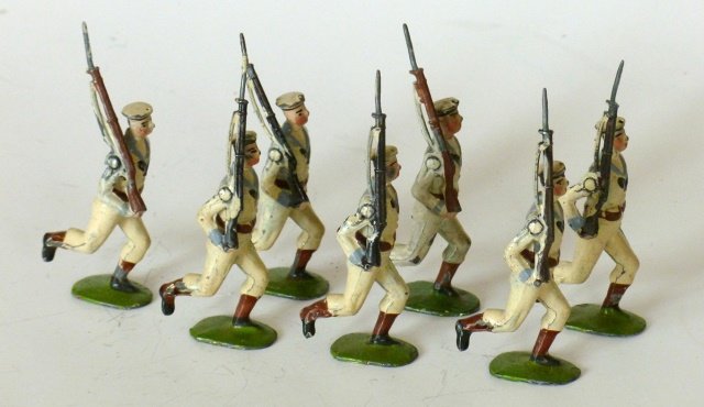 Britains from Set #80 Royal Navy, White Jackets: Pre-War. First Version. Running at the slope. Pre 1920. 7 pieces. Unboxed. Condition good, slight retouching of white uniforms.