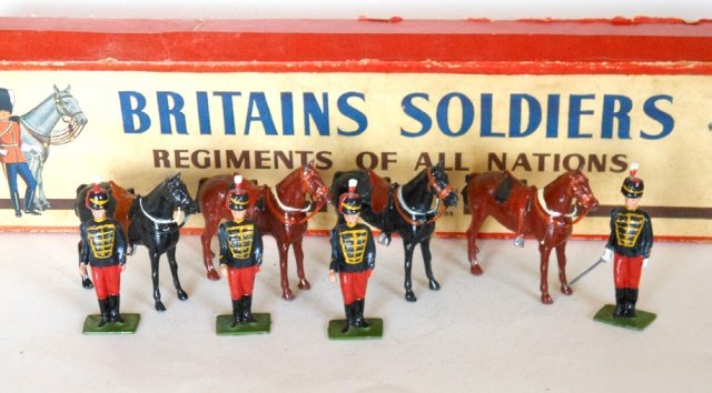 Britains Set #182 11th Hussars: Post War. 8 pieces. With original R.O.A.N. box. Untied. Condition excellent. Box good. Split at two corners of lid.