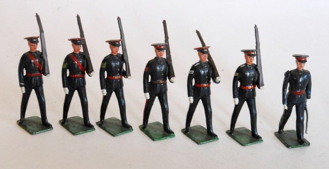Britains Special County Regiments: Post War. Special Paint. 7 pieces. County regiments. Including the Buffs, the Devonshire regiment, and the Hertfordshire regiment. Painted numbers in white on the underside of the base, indicate perha