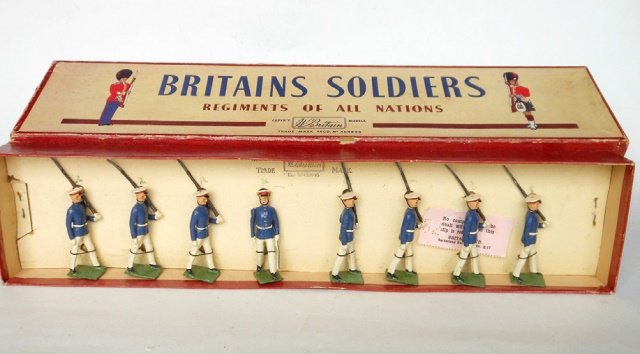 Britains RARE Set #1836 Argentine Military Cadets: Post War. 8 pieces tied in original R.O.A.N. box; condition excellent. Box very good; slight fraying on edges of lid.