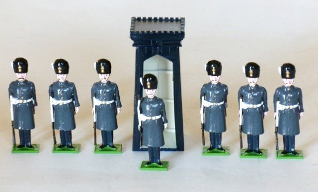 S and S Miniatures: 8 pieces. Grenadier Guards at attention, winter dress with Sentry box. Unboxed. Condition Excellent.