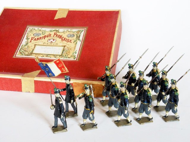 Mignot Napoleonic Volunteers: Post War. 12 pieces with original box. Untied. Condition excellent. Box good. Tape on box.