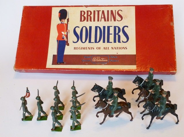 Britains Set #267 U.S. Army Display Cavalry: And Infantry. Service dress with National Standard. Post War. 13 pieces. With original Regiment of All Nations box, and original tie card. Untied. Condition excellent. Box very good. (lid split in 2 c