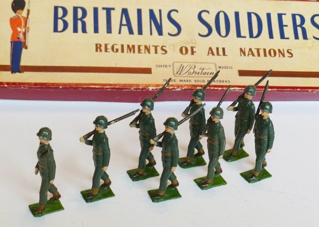 Britains Set #2033 U.S. Army Infantry: Service Dress, steel helmets. Post War. 8 pieces. With original Regiments of All Nations box. No tie card. Condition excellent. Box very good. (one corner of box split, writing on label.)