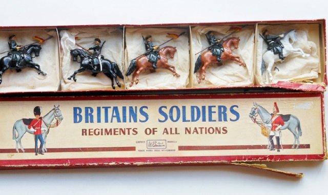 Britains Set #136 Russian Cossacks: Post War. 5 pieces. In original R.O.A.N. box. Untied. Condition very good. Box fair. (split at one corner and at 4 corners of lid.)