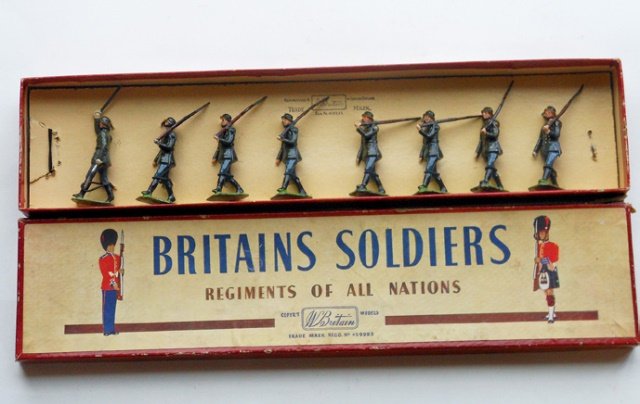 Britains Set #432 German Infantry: Post War. 8 pieces. Tied in original R.O.A.N. box. Condition excellent. Box good. (one corner of box split and 4 corners of lid split.)
