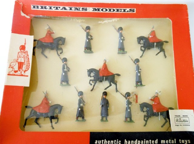 Britains Set #9306 Life Guards and Scots Guards: Post War. 12 pieces. Tied in original cellophane fronted box. Condition excellent. Box good. (2 corners split on lid)