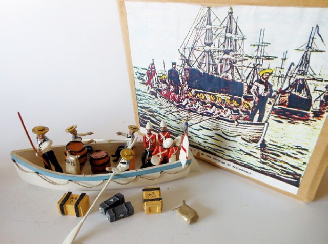 Under Two Flags Boat: Man of War naval boat. Post War. 20 pieces. With original box. One oarsman missing arm. Condition excellent. Box excellent.
