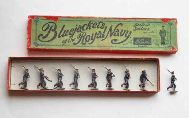 Britains from Set #78 Royal Navy, Running: Slope arms, blue uniform (probably repainted, as Britains did not issue this figure in blue) 9 pieces, with an original Whisstock box. Condition very good. Box good.