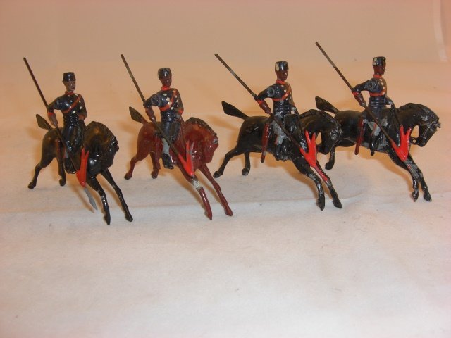 Britains from #71 Turkish Cavalry: Britains from #71 Turkish Cavalry; 1 man lance tip broken, horse leg repaired, hole in horse’s forehead; mismatched; condition very good; 4 pieces; pre war.