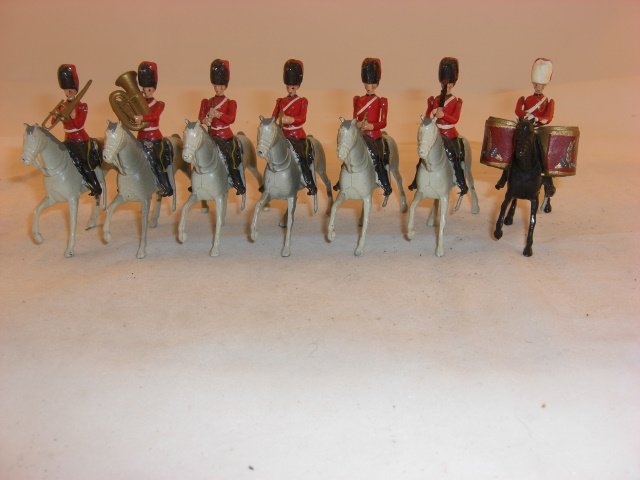 Britains #1720 Royal Scot Greys Mounted Band: Britains #1720 Royal Scot Greys Mounted Band; cymbals player has loose arm; condition excellent; 7 pieces; post war.